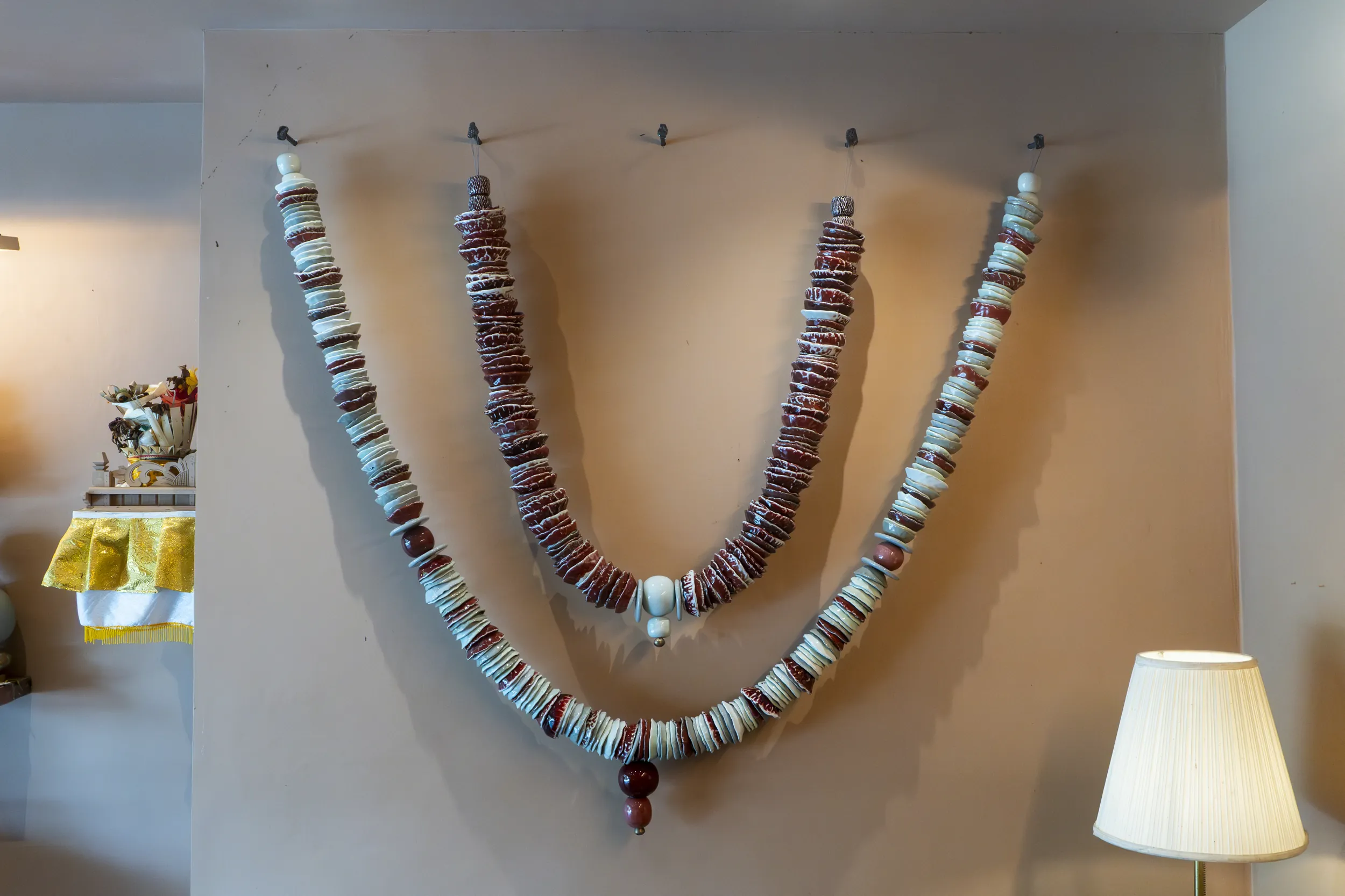 Wall display of ceramic bead garlands