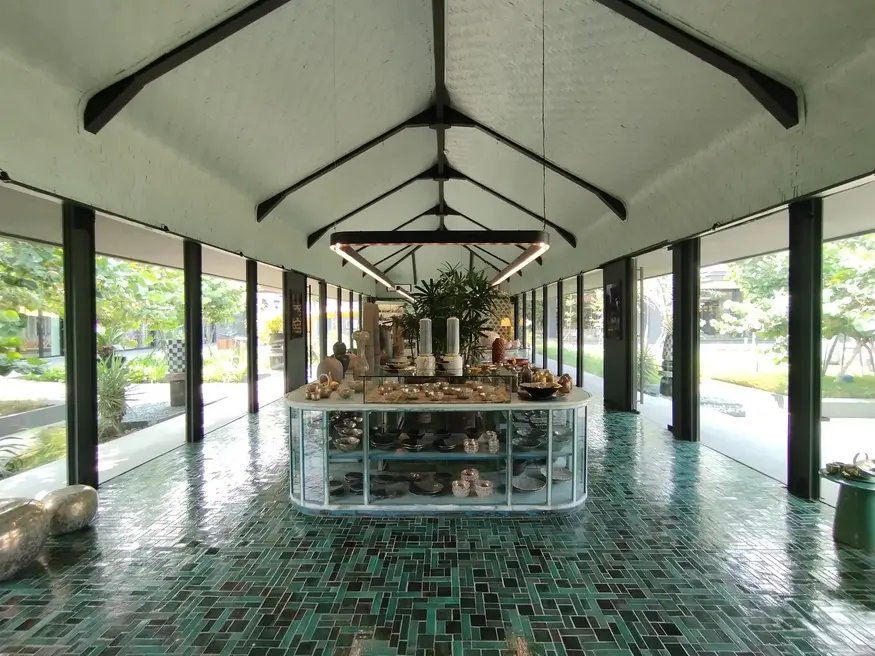 Green-tiled corridor inside the Gaya Ceramic showroom