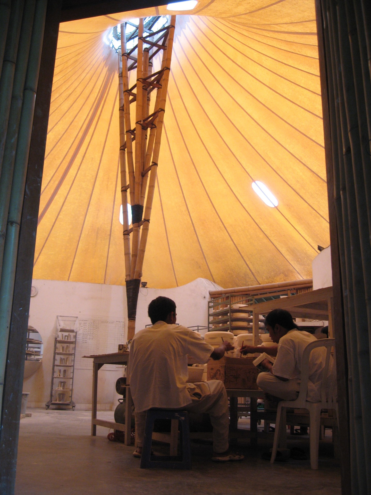 Artisans at work inside the open-air Gaya Ceramic studio in Bali
